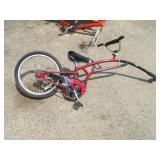 Adams share a ride trail a bike.