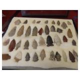 (38)prehistoric Native American arrowhead points.