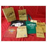 Assorted Hard Rock Cafe bags.