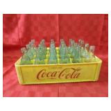 Coca cola bottles & carrying crate.