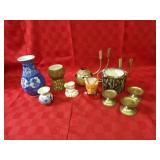 Brass candle holders, vases, household decor.