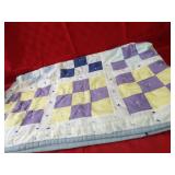 King quilted blanket.