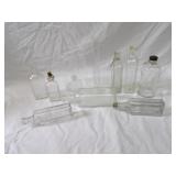 Assorted vintage glass bottles.