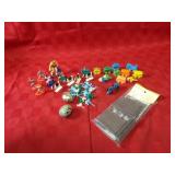Plastic toy trains, cupcake toppers, figures.