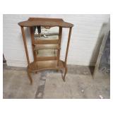 Antique mirrored back display shelf.