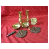 Brass candle holders, trivets, clock weight.