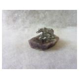 Amethyst crystal w/pewter figure.