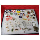 Showcase of collectibles. charms, pins, earrings