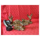 Deer & skunk figure yard decor.