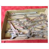 Assorted wrenches, tools.