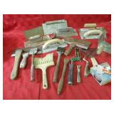 Scrapers, trowels, assorted tools.