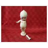 Vintage carnival kewpie doll figure. Chalkware