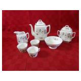 Porcelain China tea set. pitcher, cups, bowls
