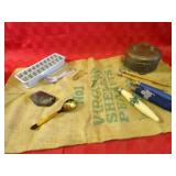 Peanut sack, ice cube tray, brass container,