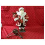 Santa figure, Christmas tree stand.