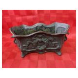 Cast iron wreath planter.