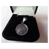 Sterling Silver Aztec calendar pendant.