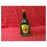 J&B old whiskey bottle w/cradle.