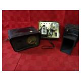 Old cameras, vintage tube type clock.