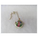 Artist signed Courting couple pendant.