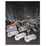 (3) SNES Controllers (1) NES Controller; Game