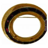 Gold Circular Brooch with Red Gem Accents