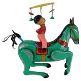 Vintage Tin Wind-Up Toy Featuring a Horse with Rid