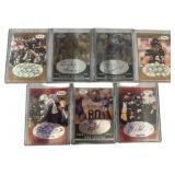 Seven Signed Football Cards Featuring Various Play