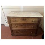 Antique marble top chest of drawers.