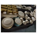 Lunning Inc gold, and white dishes. Includes 24