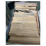 Box full of hundreds of souvenir postcards early