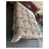 2 Handmade quilts shown on a full-size bed