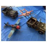 2 Tonka jeeps and 2 Hugely airplane toys.