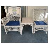 Two wicker chairs and side table, solid and
