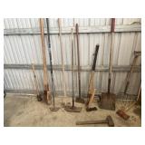 Yard tools, including sledgehammers, post hole