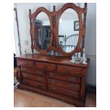 Large dresser with double mirrors items on