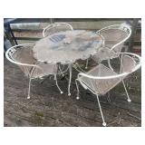 Heavy metal patio table and four chairs.