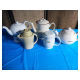 teapots and one small creamer