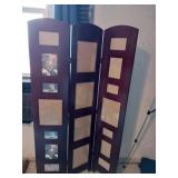 Three panel wooden room divider with photo frames