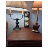 Two lamps and a thermometer barometer wall