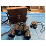 Binoculars. Two pair. One is Bushnell and the