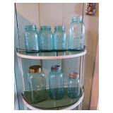 Several green glass jars three with lids see