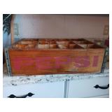 Two wood crates one is Pepsi one is for candles