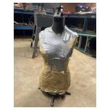 Maniquin with cast iron base. Doesnï¿½t appear to