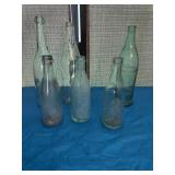 Vintage soda bottles, including perfection, soda,