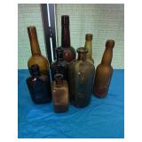 Brown/amber colored bottles. Including one a.