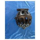 Cast iron yarn/string holder. Wall mounted.