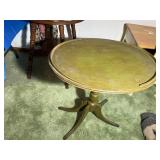 Vintage side table has been painted a dark green