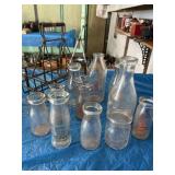 12 bottles and carrier, including three St. Louis