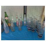 Vintage soda bottles, including old Dr Pepper